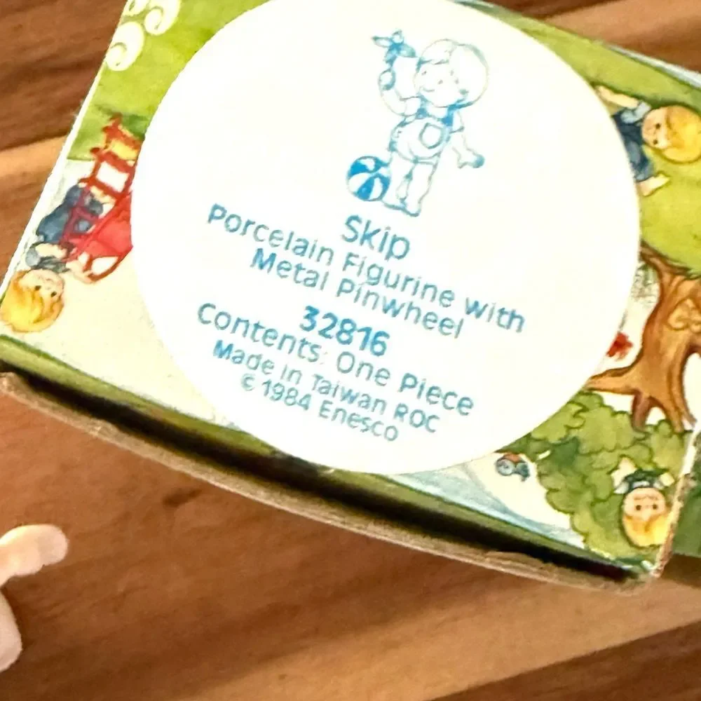 Enesco Country Cousins Skip Holding A Pinwheel